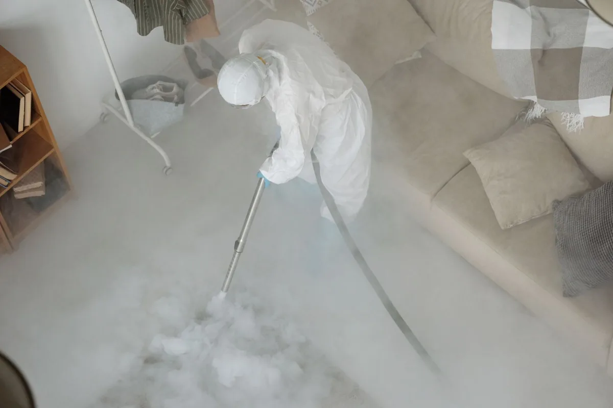 Biohazard cleanup technician in protective equipment, Stevenson, WA